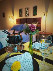 a table with a table set with plates and flowers on it at Loft Giese in Navegantes