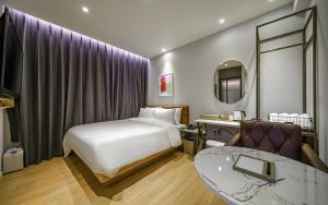 Postel nebo postele na pokoji v ubytování GijangYeonhwari No,25 Hotel