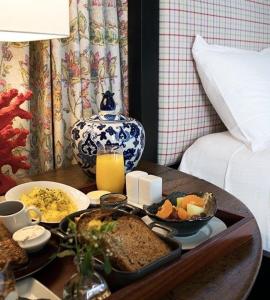 a tray of food on a table in a room at L'Auberge Carmel, Relais & Chateaux in Carmel