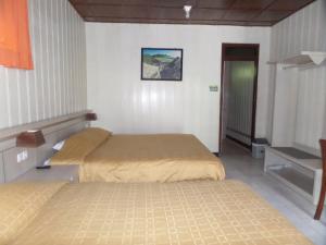Ein Bett oder Betten in einem Zimmer der Unterkunft Bromo Permai 1