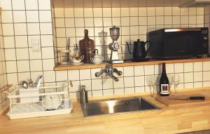 Kuchyň nebo kuchyňský kout v ubytování L'AtelieR Guest House Yonago