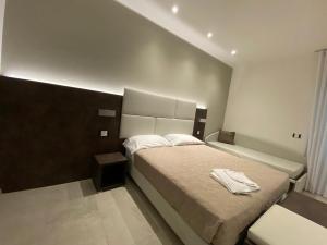 Postel nebo postele na pokoji v ubytování B&B Bertani