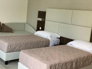 Postel nebo postele na pokoji v ubytování B&B Bertani