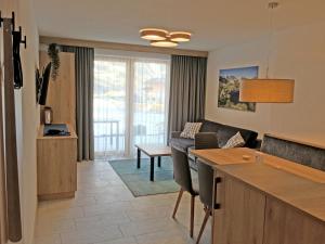 a living room with a couch and a table at Haus Tirol in Ladis