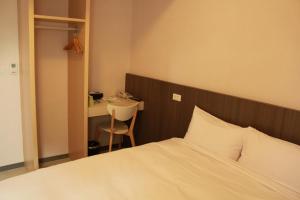 Postel nebo postele na pokoji v ubytování Sunnyside Hotel