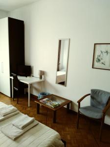 Postel nebo postele na pokoji v ubytování B&B in Arena L' Opera