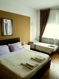 Postel nebo postele na pokoji v ubytování B&B in Arena L' Opera