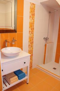 a bathroom with a sink and a shower at Chalupa u Smolíků in Brtnice