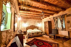 Postel nebo postele na pokoji v ubytování Cappadocia Caves Hotel