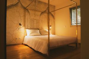 Кровать или кровати в номере La Forestale Luxury Ecolodge B&B Primo Piano