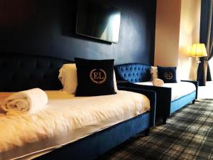 a bedroom with a bed and a nightstand at Edinburgh Lodge West End in Edinburgh