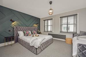 Ένα ή περισσότερα κρεβάτια σε δωμάτιο στο Cuckoo Rooms