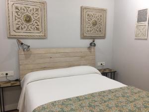 A bed or beds in a room at Agroturismo Ibarra