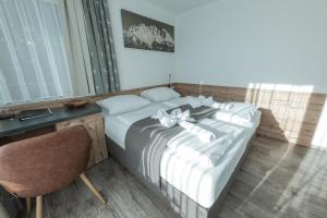 Voodi või voodid majutusasutuse Pension Rainer toas