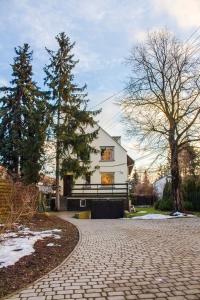 a house on a cobblestone driveway at Marymont in Warsaw