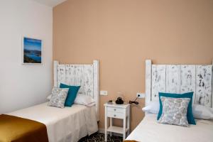 Łóżko lub łóżka w pokoju w obiekcie Apartamentos Rurales Helechosa, Las Tres Peñas