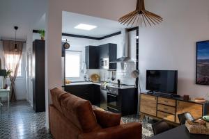 Telewizja i/lub zestaw kina domowego w obiekcie Apartamentos Rurales Helechosa, Las Tres Peñas