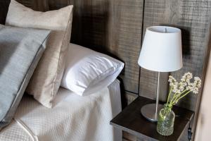 Łóżko lub łóżka w pokoju w obiekcie Apartamentos Rurales Helechosa, Las Tres Peñas