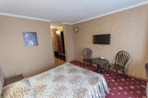 Ένα ή περισσότερα κρεβάτια σε δωμάτιο στο Отель Наутилус