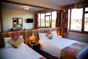 Letto o letti in una camera di West County Hotel