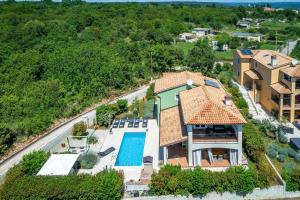 an aerial view of a house with a swimming pool at Villa Branca 6+2 in Krnica +31 photos
