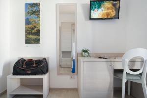 TV a/nebo společenská místnost v ubytování Hotel Olympia