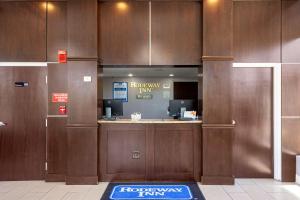 a lobby with a reception desk in a building at Rodeway Inn Port Richey North in Port Richey
