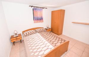 Postel nebo postele na pokoji v ubytování Apartments Goldie