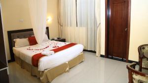 Ένα ή περισσότερα κρεβάτια σε δωμάτιο στο Lakemark Hotel and Tour Service Bahir Dar
