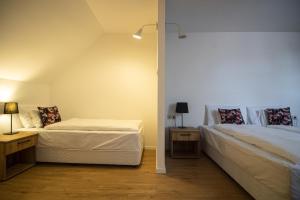 A bed or beds in a room at Jégverem Fogadó