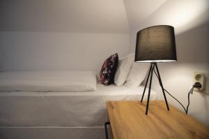 A bed or beds in a room at Jégverem Fogadó