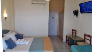 Posteľ alebo postele v izbe v ubytovaní Porto Skala Village Hotel