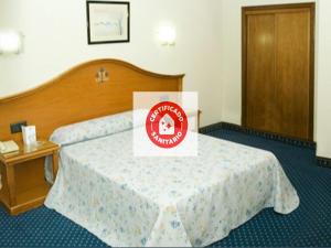 A bed or beds in a room at Hotel Ébora by Vivere Stays