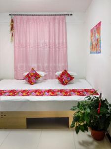 Ένα ή περισσότερα κρεβάτια σε δωμάτιο στο Rime Island Manzhaosongju Inn