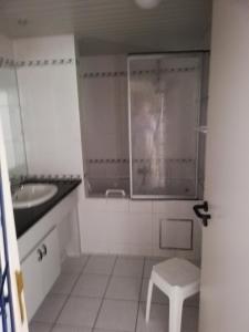 a bathroom with a toilet and a sink and a stool at DURBUY-COSY Appartement 2 in Durbuy