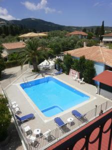 a view of a swimming pool on a balcony at Polyxenis Rooms in Lygia