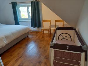 Postel nebo postele na pokoji v ubytování Grand appartement Marie-Thérèse