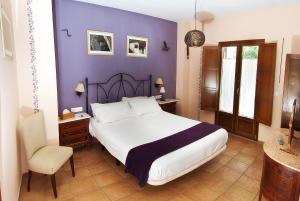 Łóżko lub łóżka w pokoju w obiekcie Hotel Posada San Marcos, Alájar