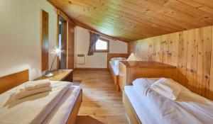 Łóżko lub łóżka w pokoju w obiekcie Appartements Christine