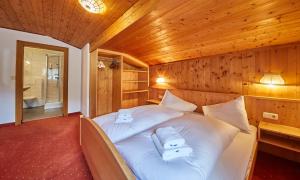 Łóżko lub łóżka w pokoju w obiekcie Appartements Christine