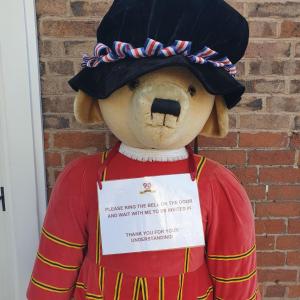 a teddy bear wearing a red shirt and a hat at Gorgeview Cottage in Ironbridge