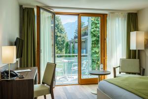 Postel nebo postele na pokoji v ubytování Hotel Artos Interlaken + 37 fotografií