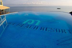 a close up of the hood of a car with a beach resort sign at Malaika Beach Resort in Mwanza