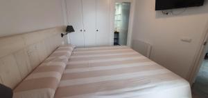 Postel nebo postele na pokoji v ubytování Apartamento en primera linea de mar - Sant Antoni de Calonge