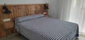 Postel nebo postele na pokoji v ubytování Apartamento en primera linea de mar - Sant Antoni de Calonge