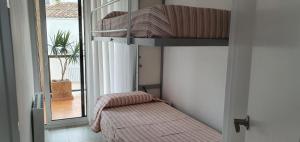 Postel nebo postele na pokoji v ubytování Apartamento en primera linea de mar - Sant Antoni de Calonge