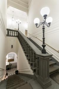 Un pat sau paturi într-o cameră la Palazzo Lorenzo Hotel Boutique & Spa