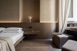 Katil atau katil-katil dalam bilik di Hotel dei Barbieri +77 gambar