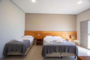 Postel nebo postele na pokoji v ubytování Pousada Mar de Minas