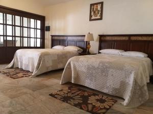 Postel nebo postele na pokoji v ubytování MAJU HOTEL CAMPESTRE & SPA